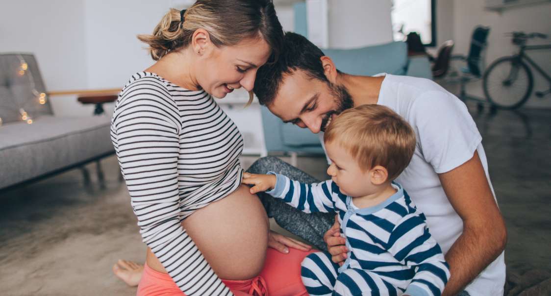 Pregnant woman with family